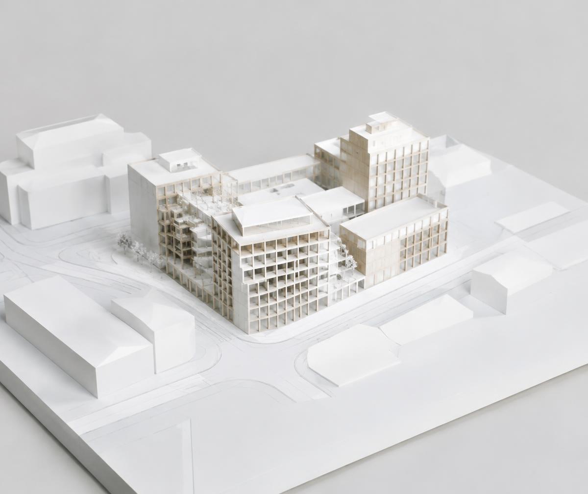 White architectural massing model of a mixed-use block